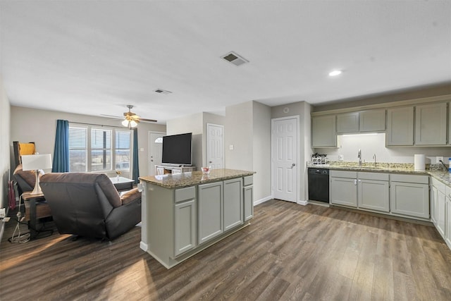 kitchen with dark wood-type flooring, black dishwasher, gray cabinets, ceiling fan, and light stone counters