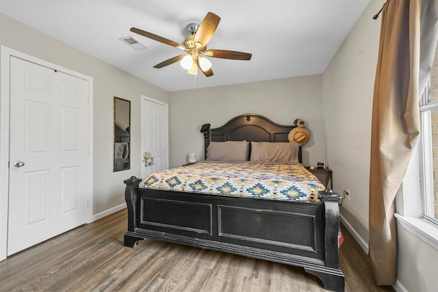 bedroom featuring ceiling fan and dark hardwood / wood-style flooring