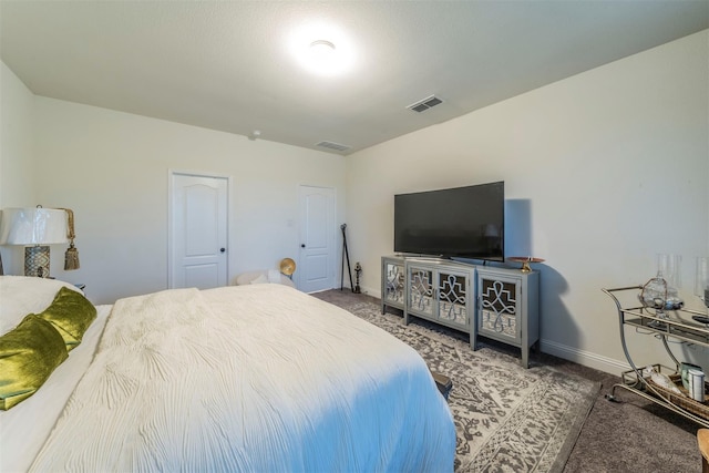 bedroom with dark colored carpet