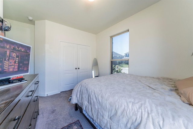 carpeted bedroom with a closet