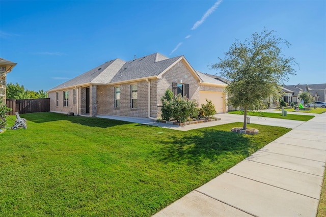 view of side of property with a lawn and a garage