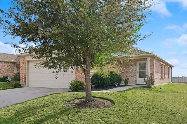 view of front of property featuring a garage and a front yard