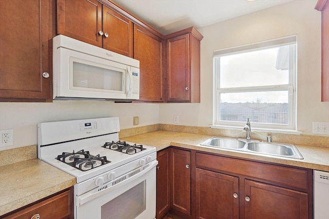 kitchen with sink and white appliances