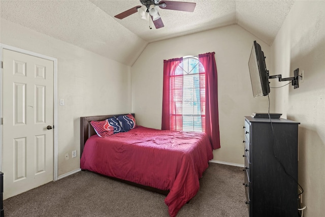 carpeted bedroom featuring ceiling fan, lofted ceiling, and a textured ceiling