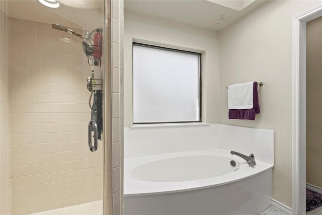 bathroom with shower with separate bathtub