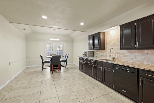 kitchen with dishwasher, lofted ceiling, sink, light tile patterned floors, and tasteful backsplash