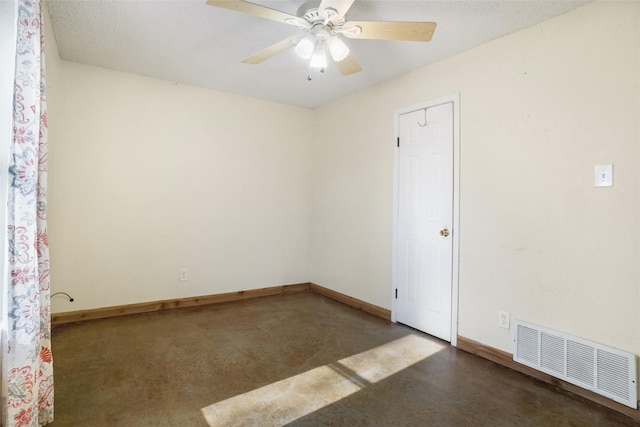 spare room with ceiling fan