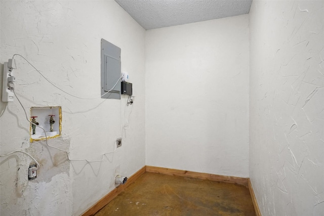 clothes washing area featuring electric panel, hookup for a washing machine, a textured ceiling, and hookup for an electric dryer