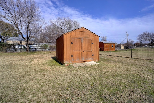 view of outdoor structure featuring a lawn