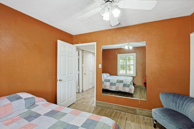 bedroom featuring ceiling fan and light hardwood / wood-style floors