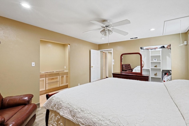 bedroom with ceiling fan and wood-type flooring