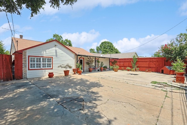 rear view of house with a patio