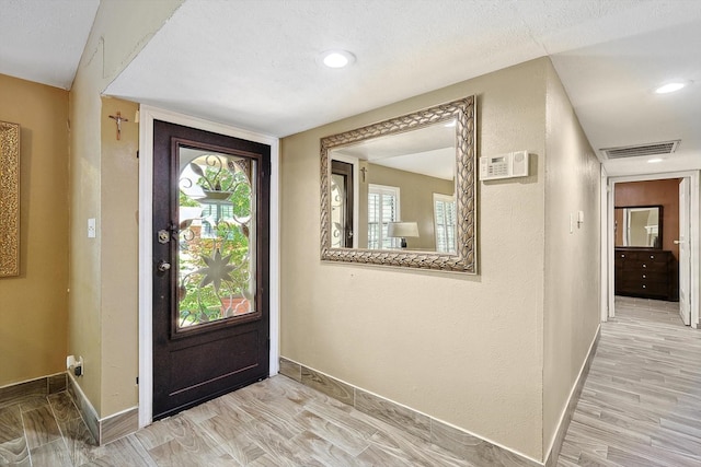 entrance foyer with light hardwood / wood-style floors