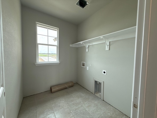 clothes washing area featuring gas dryer hookup, hookup for an electric dryer, washer hookup, and laundry area