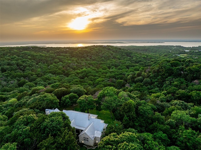 aerial view at dusk with a water view