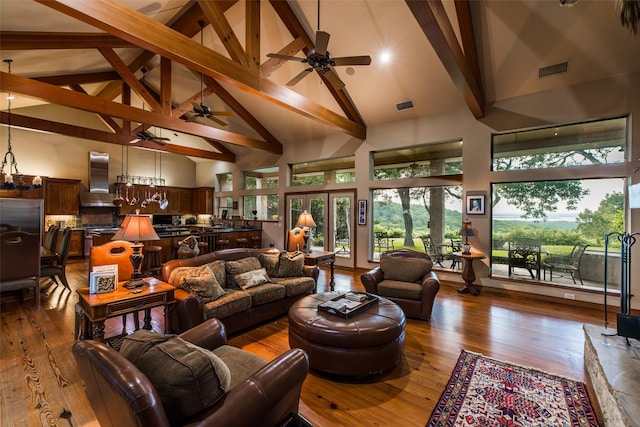 living room featuring beamed ceiling, french doors, high vaulted ceiling, and hardwood / wood-style floors