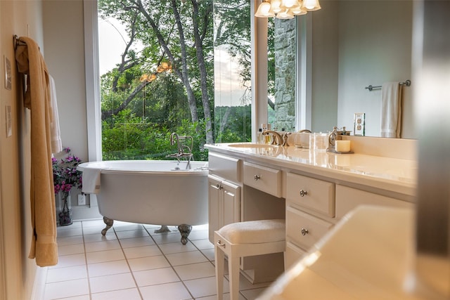 1665 W Belt Line Rd, Cedar Hill, TX 75104 - bathroom featuring tile patterned floors, a freestanding bath, vanity, and a chandelier