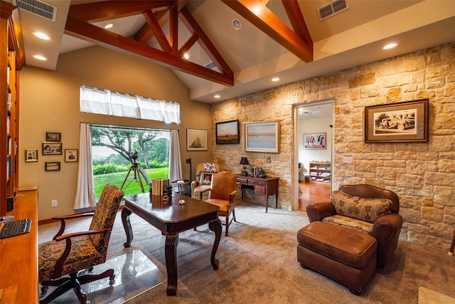 carpeted home office with beam ceiling and high vaulted ceiling