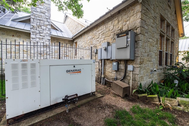 1665 W Belt Line Rd, Cedar Hill, TX 75104 - exterior view of stone siding, a power unit, a skylight, and fence