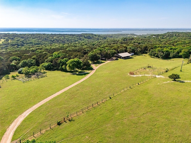 birds eye view of property with a rural view and a water view