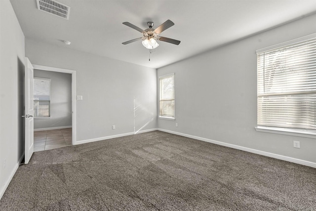 carpeted empty room with ceiling fan