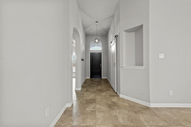 hallway featuring a barn door