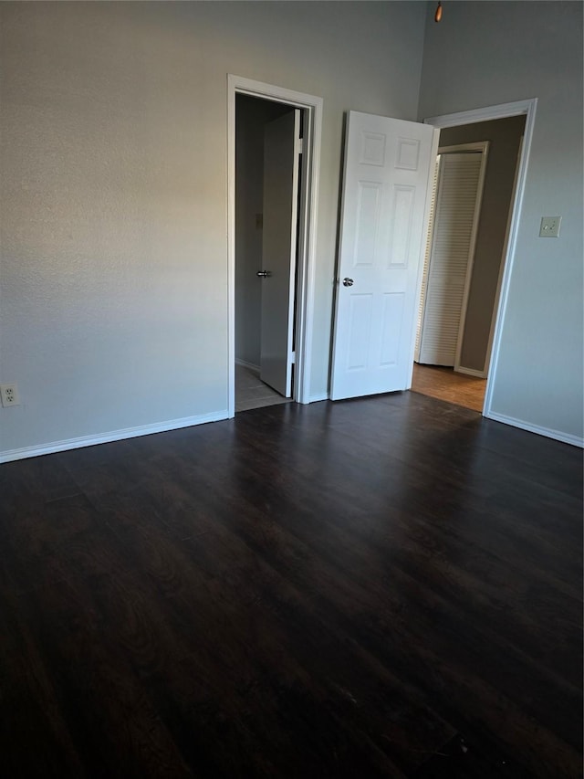 empty room featuring dark hardwood / wood-style floors