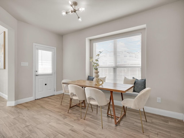 dining room featuring a wealth of natural light and a chandelier