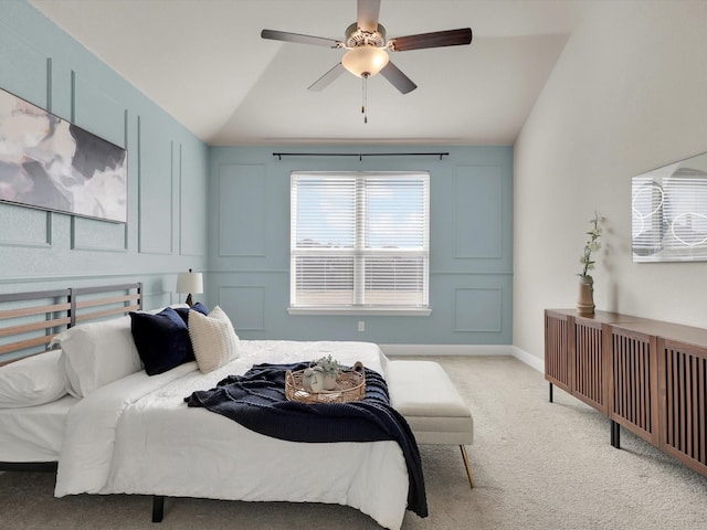 bedroom featuring ceiling fan, light colored carpet, and lofted ceiling