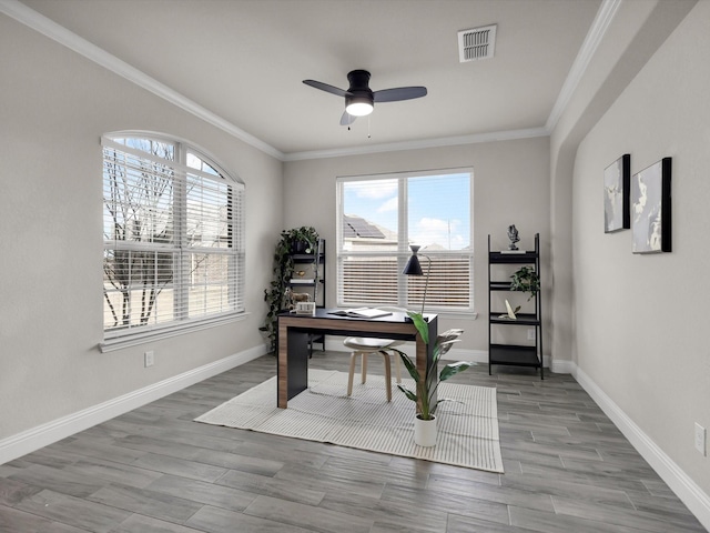 office area featuring ceiling fan and crown molding