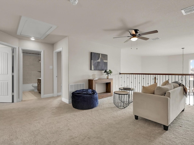 living room featuring ceiling fan and light carpet