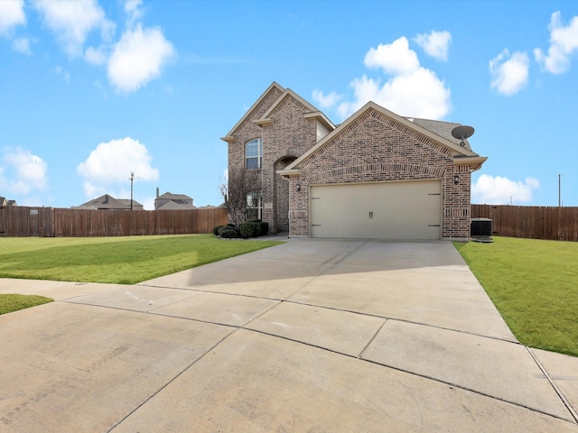 front facade with a garage, a front yard, and central air condition unit