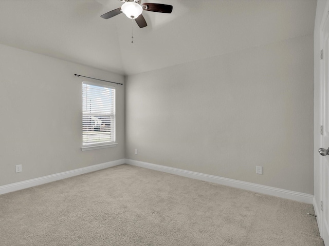 unfurnished room with ceiling fan, light colored carpet, and lofted ceiling