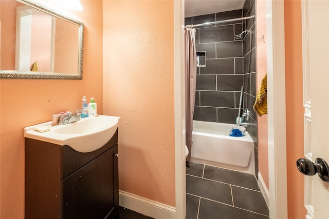 full bathroom with tile patterned flooring, shower / bath combo, vanity, and toilet