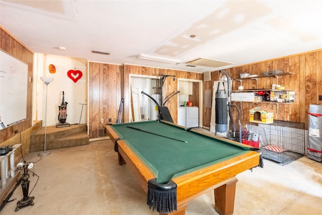 rec room with concrete flooring, pool table, wooden walls, and washing machine and clothes dryer