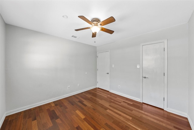 empty room with ceiling fan and wood-type flooring