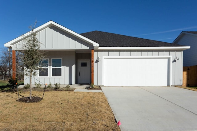 ranch-style home featuring a front yard and a garage