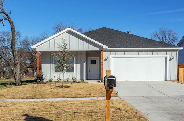 ranch-style home with a front yard and a garage