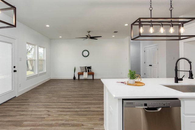 kitchen featuring dishwasher, sink, hanging light fixtures, hardwood / wood-style flooring, and ceiling fan