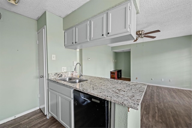 kitchen featuring kitchen peninsula, ceiling fan, sink, white cabinets, and black dishwasher