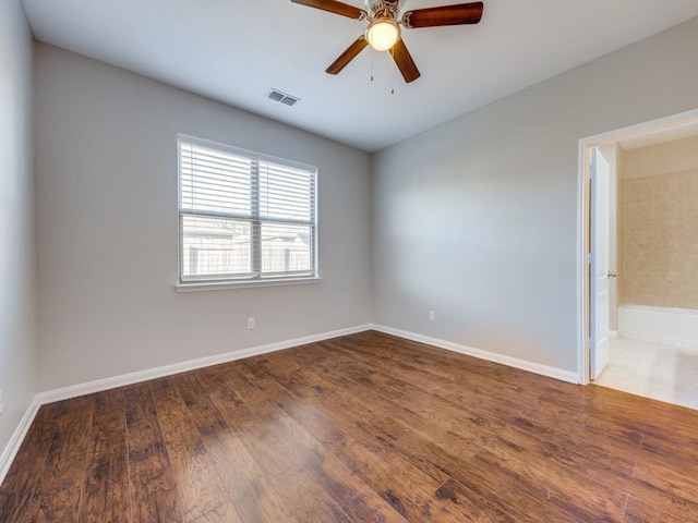 spare room featuring ceiling fan and wood-type flooring