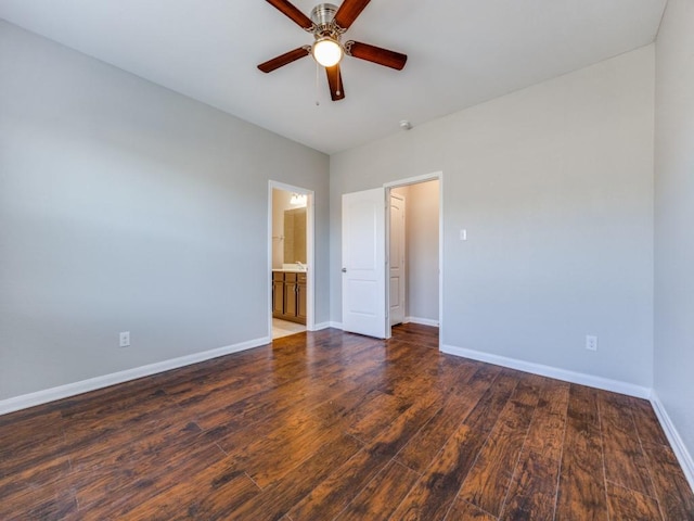 unfurnished bedroom with connected bathroom, ceiling fan, and dark hardwood / wood-style floors