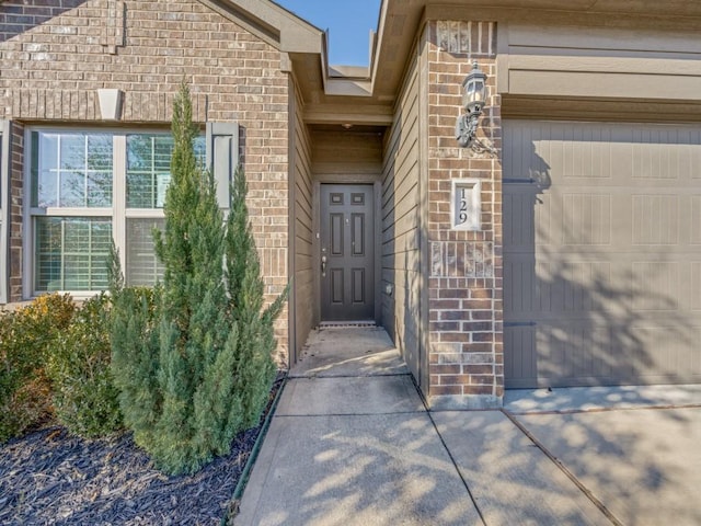 view of exterior entry featuring a garage