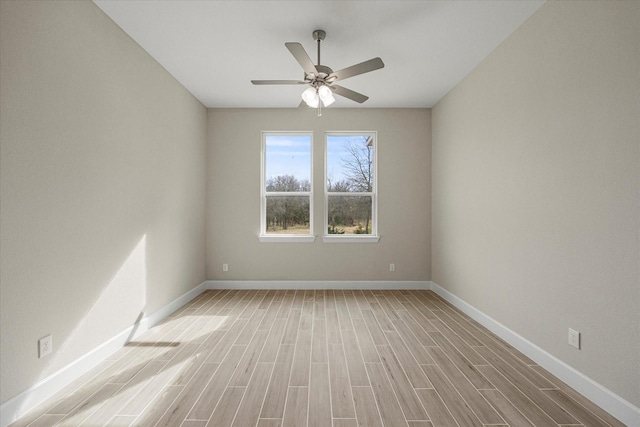 unfurnished room with ceiling fan and light hardwood / wood-style flooring