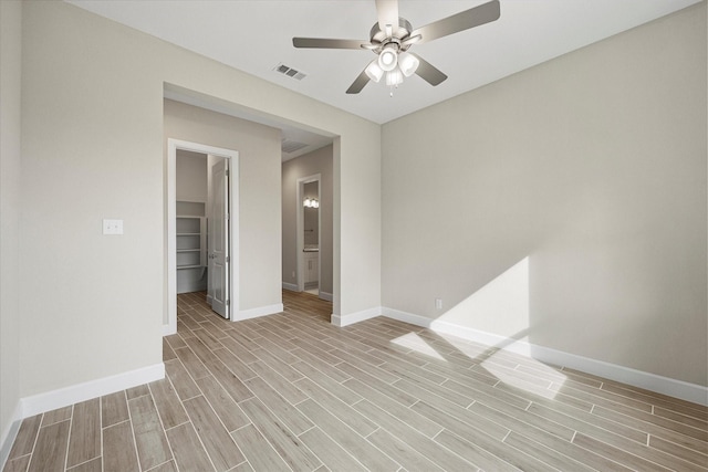 unfurnished room featuring light wood-type flooring and ceiling fan