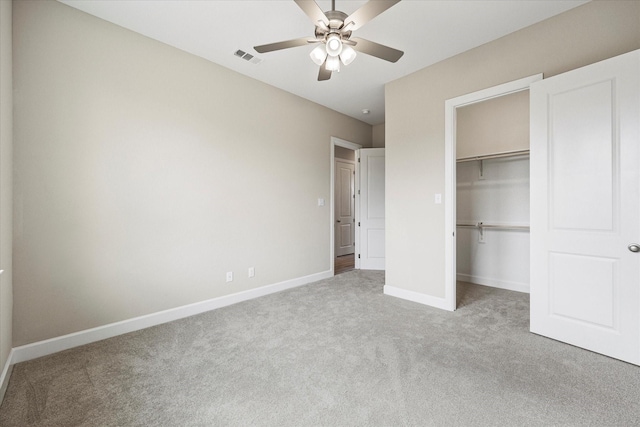 unfurnished bedroom with ceiling fan, a closet, and light colored carpet