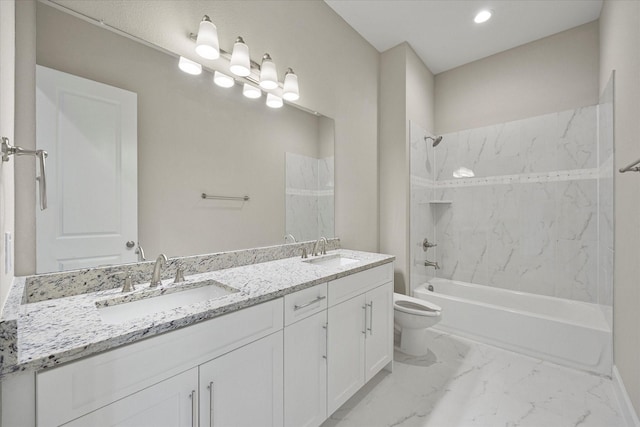 full bathroom featuring toilet, tiled shower / bath combo, and vanity