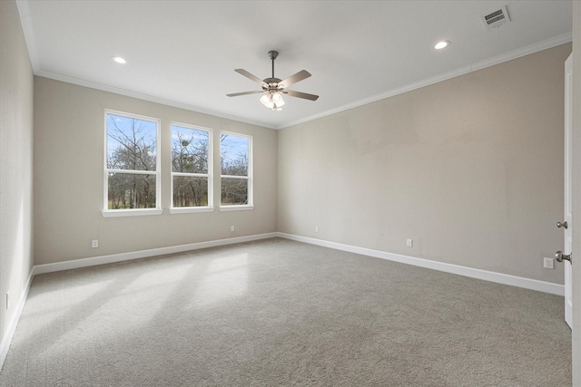 unfurnished room featuring ceiling fan, carpet, and ornamental molding