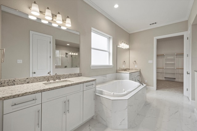 bathroom with vanity, ornamental molding, and separate shower and tub