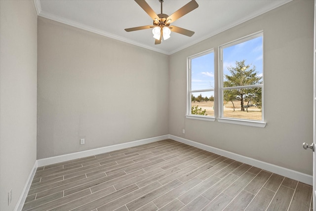 empty room featuring ceiling fan, crown molding, and light hardwood / wood-style floors